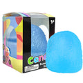 Squishy sugar cube stress toy, bright blue, in colorful box packaging