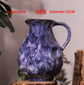 Oil-painting style ceramic handled pitcher vase, glossy deep purple with marbled streaks
