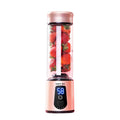Pink portable juicer blender with clear cup, strawberry pieces inside, LED 58 display