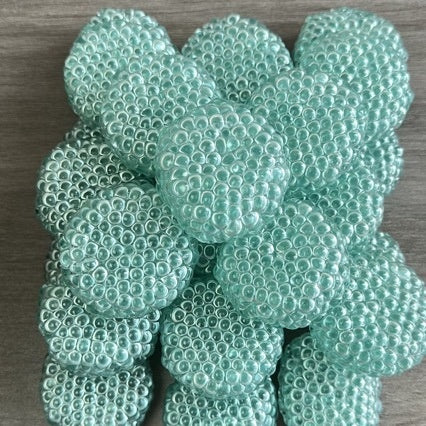 Set of mint-green textured stress-relief balls with raised bubble-like dimples