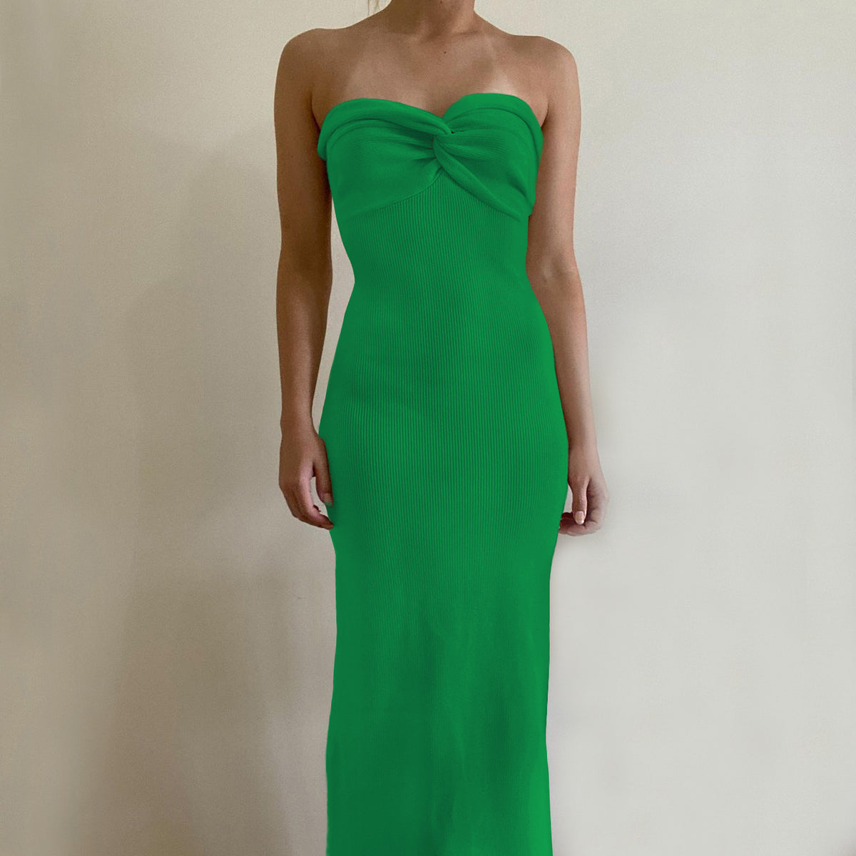 Off-shoulder knit wrap dress in bright green with knotted neckline, long silhouette