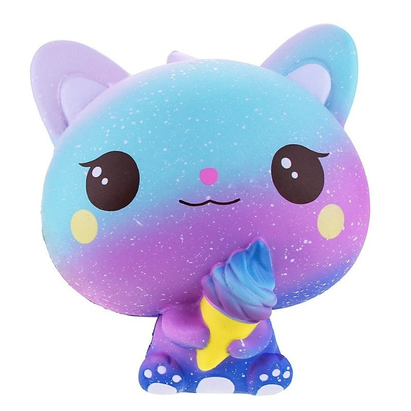 Galaxy unicorn squishy toy with closed eyes, sparkles, and rainbow mane