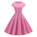 Pink polka-dot midi dress, cap sleeves, tied waist bow