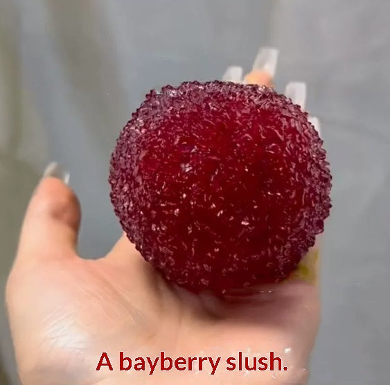 Red textured bayberry-shaped squishy stress toy with stem, side view