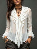 White ruffled chiffon blouse with V-neck and long bell sleeves, sheer overlay