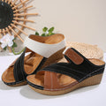 Women's black wedge slip-on slippers with white hook-and-loop strap and tan lining
