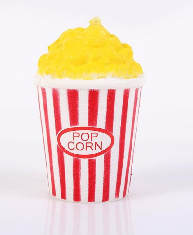 Slow-rising squishy toy popcorn cup with white red stripes and yellow top