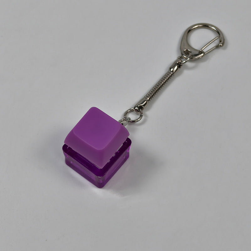 Purple square finger-popping keychain toy with spring chain and snap buttons