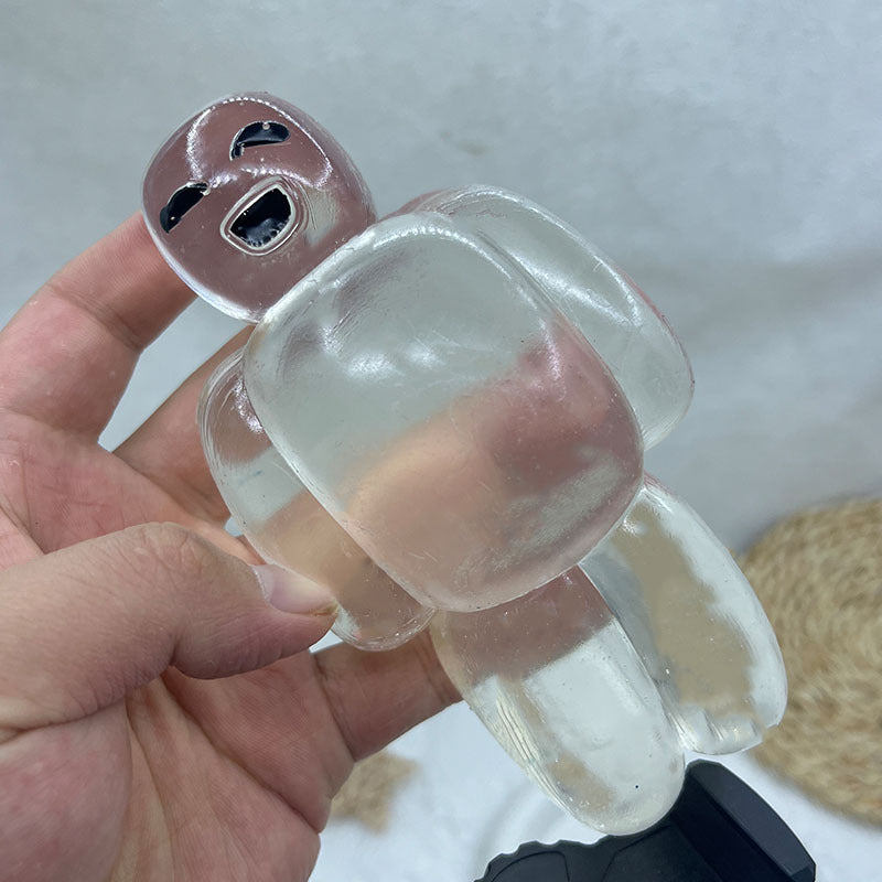 Clear robot stress relief squeeze toy in hand, side view with rounded legs and paw pads