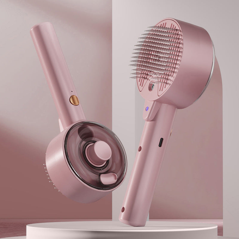 Pet grooming spray comb with UVC sterilization, pink handheld with circular charging base