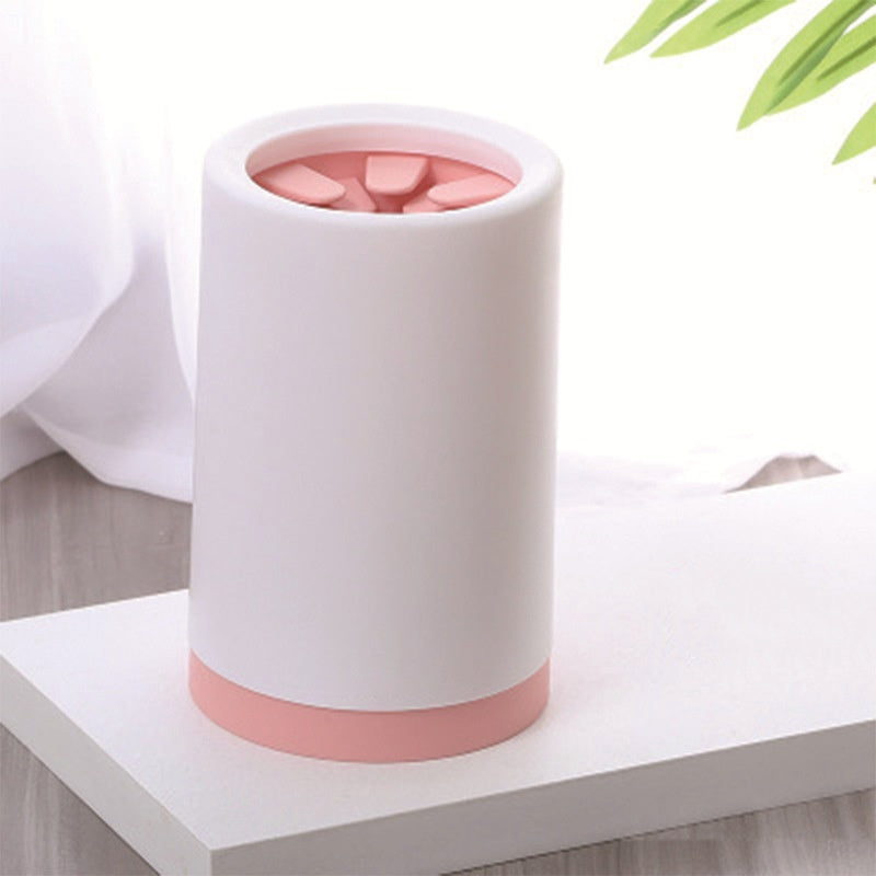 White dog paw cleaner cup with pink silicone bristle insert
