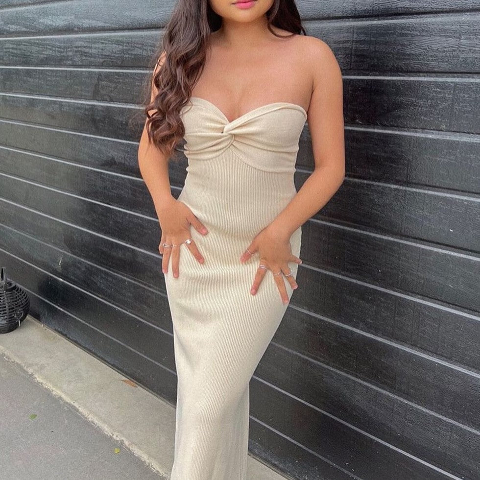 Cream off-shoulder knit maxi dress with knotted strapless neckline, slim fitted shape.