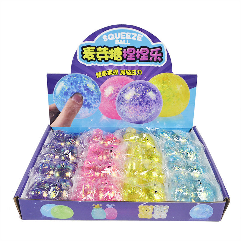 Boxed display of translucent glitter maltose bear squeeze balls in mixed colors