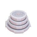 Silicone food storage bowl set with clear snap lids and pink accents, stacked