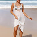 White sleeveless beach cover-up dress with scalloped lace yoke and asymmetrical hem