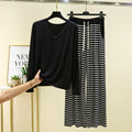 Women’s modal pajama set with black long-sleeve V-neck top and striped pants