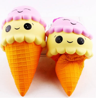 Pair of squishy ice-cream cone toys with pink cloud tops and smiling faces