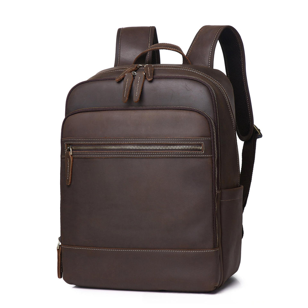Coffee-brown leather backpack with top handle and front zip pocket, two side straps