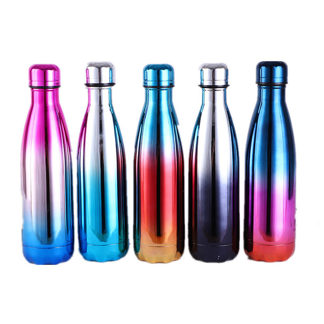 Set of gradient color stainless steel water bottles on a white background
