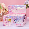 Boxed cat-paw squeeze toy set with light purple flower-theme design