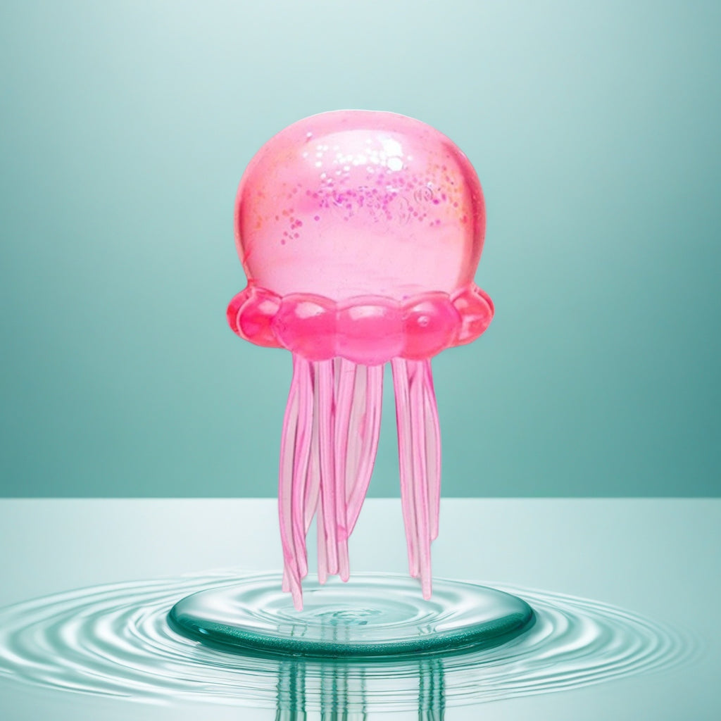 Pink octopus squishy toy with glittery head and long translucent dangling tentacles