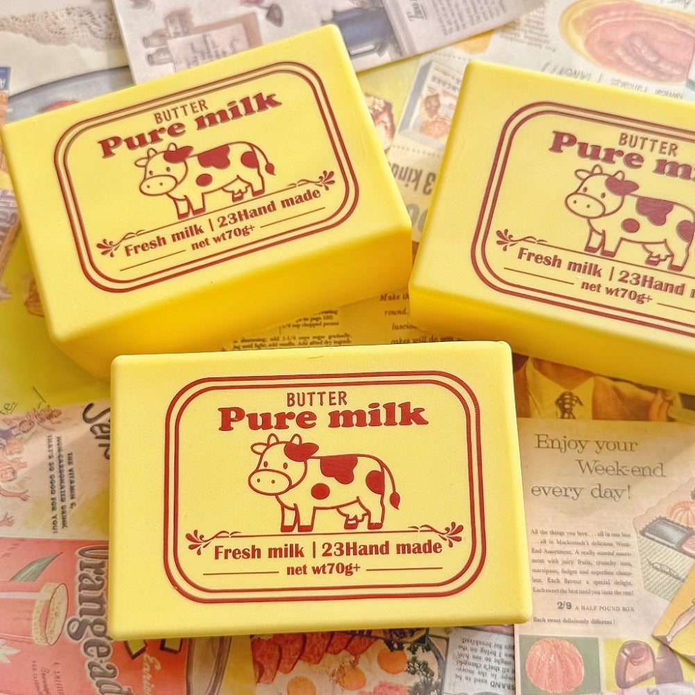 Yellow milk-labeled squeeze toy cube with cow graphic, slow-rebound stress reliever