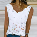 White sleeveless V-neck top with small butterfly print