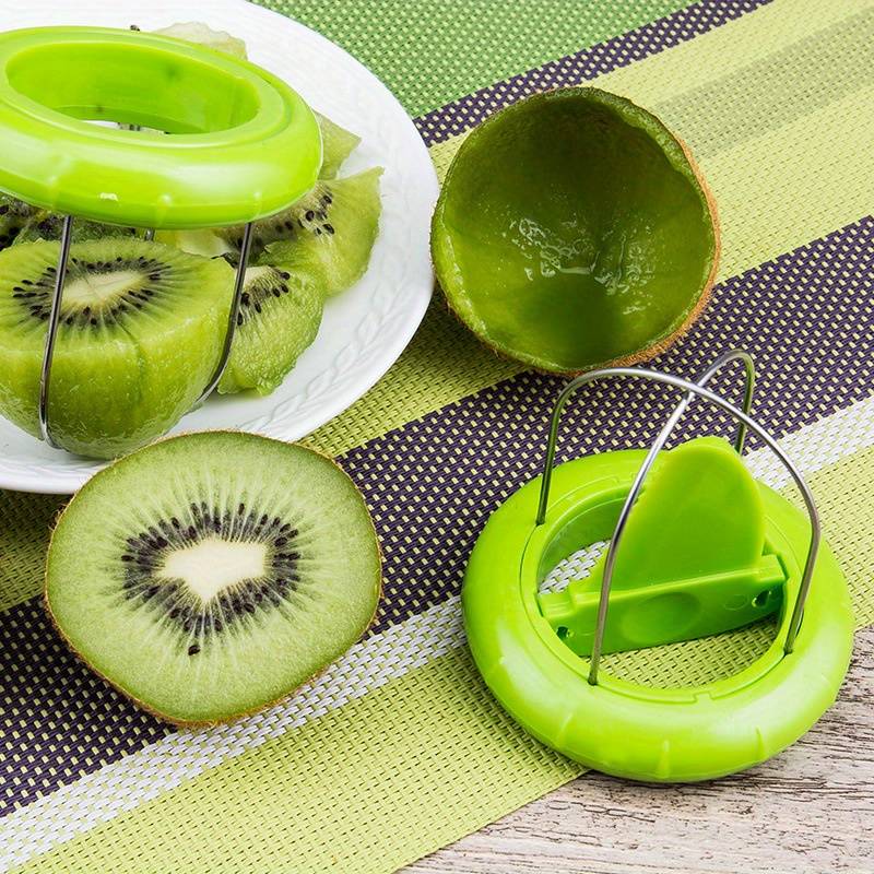 Green kiwi peeler and splitter tool with two prongs and circular handle