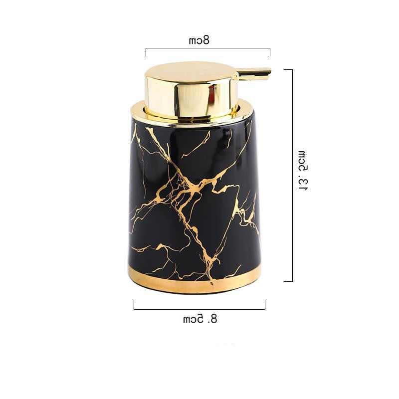 Black ceramic foam soap dispenser with gold pump top and marble vein pattern