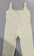 Women's sleeveless spandex workout bodysuit, light cream, scoop neck, one-piece fit