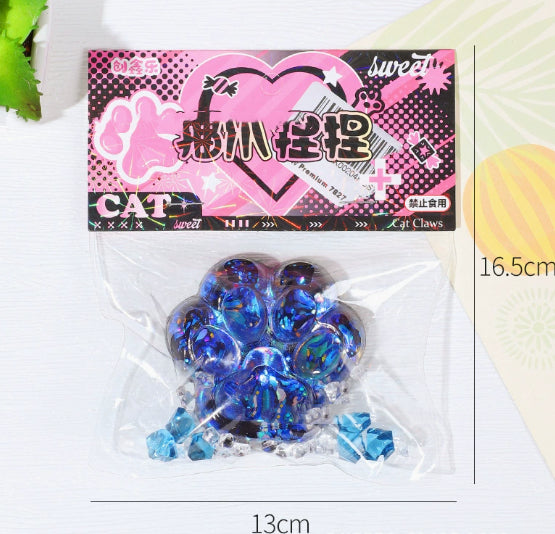 Bright blue glitter cat paw stress toy in clear blister pack