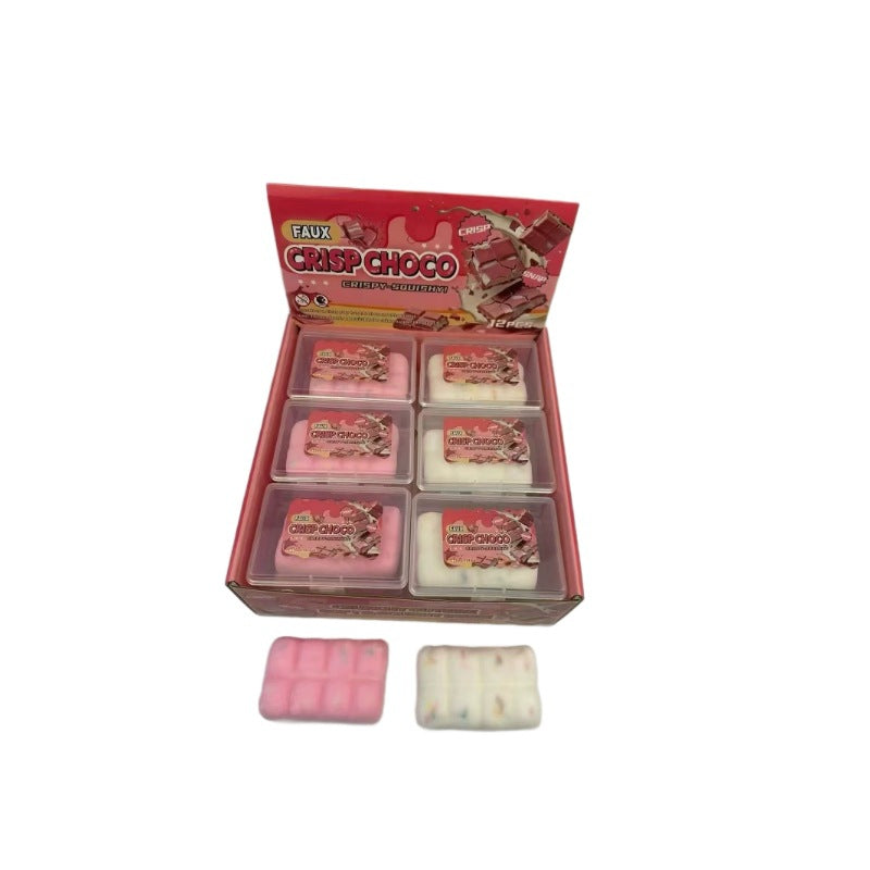 Faux chocolate squeeze toys in open square tray, with one pink and one white bar