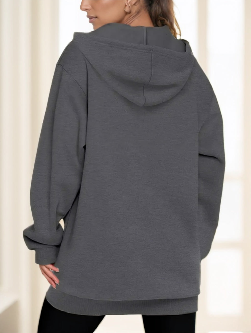 Women's grey long zip-up hoodie, back view with hood and relaxed fit