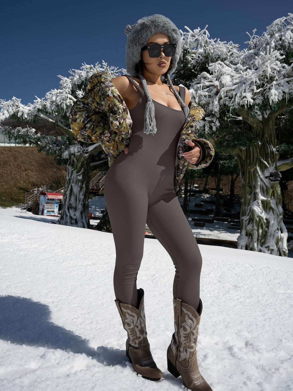 Taupe sleeveless fitted bodysuit, scoop neckline and long full-length legs.