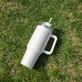 Large insulated stainless steel tumbler, white finish with clear lid and straw, handle