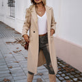 Beige women's long coat with turn-down collar, front buttons, and side flap pockets