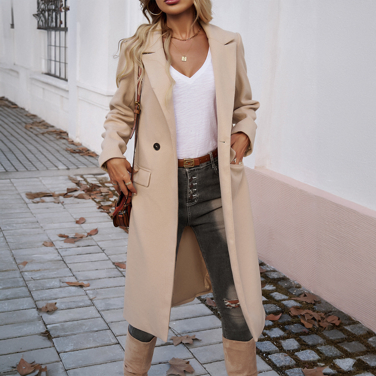 Beige women's long coat with turn-down collar, front buttons, and side flap pockets