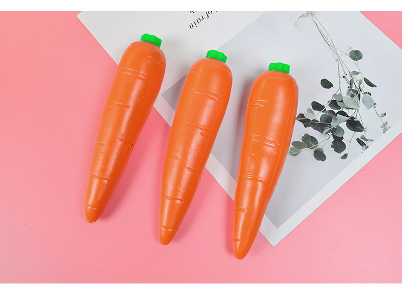 Three orange carrot-shaped stress relief toys with green caps