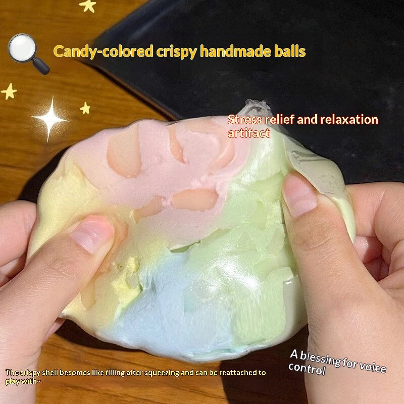 Pastel candy-colored crispy sphere stress-relief squeeze toy, being squeezed by hands