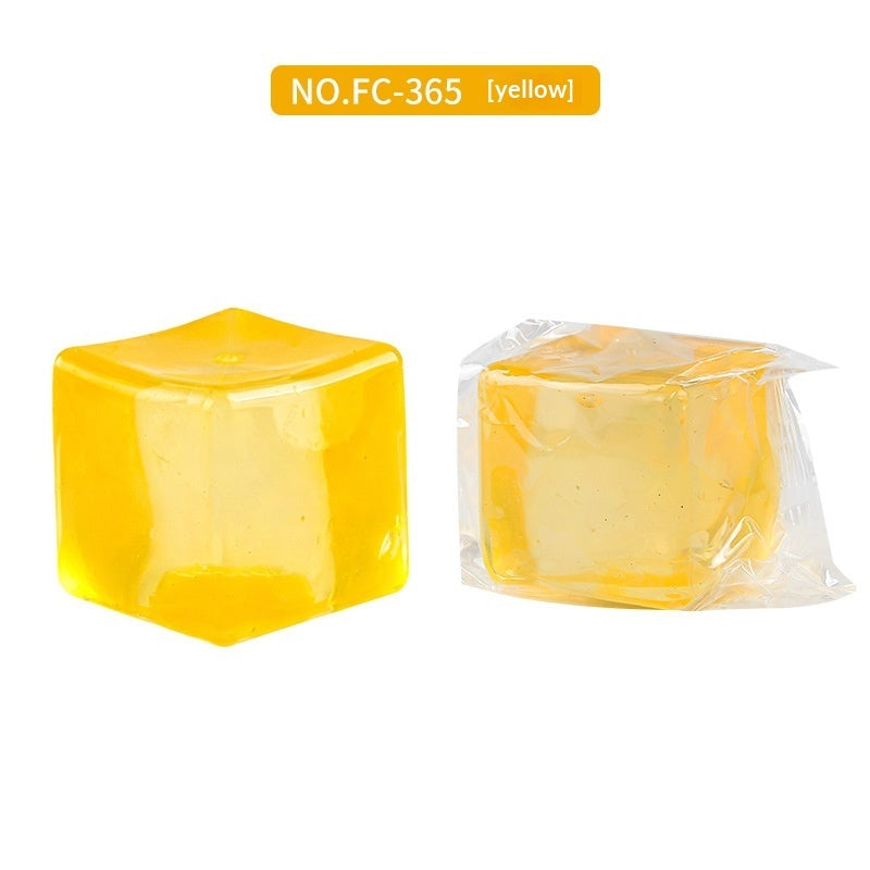 Yellow transparent square fidget ball, shown alone and in a sealed bag
