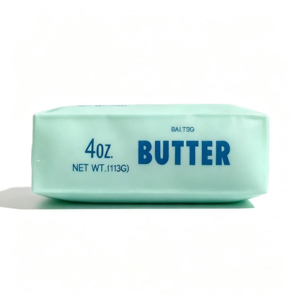 Mint green butter-shaped squishy stress-relief toy bar, front view