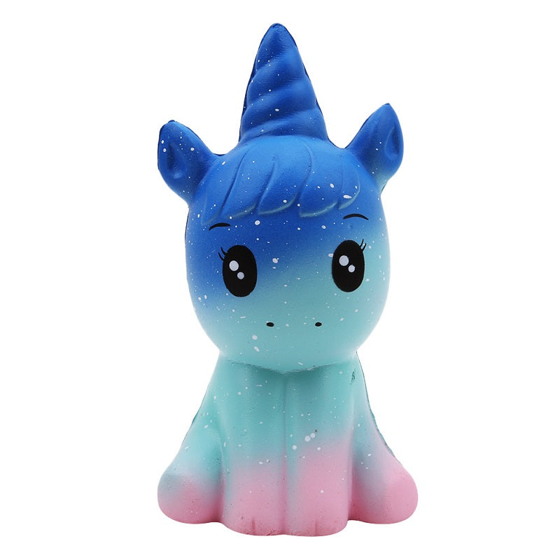 Sparkly blue cat-unicorn plush toy with star-speckled body, closed eyes and smile.