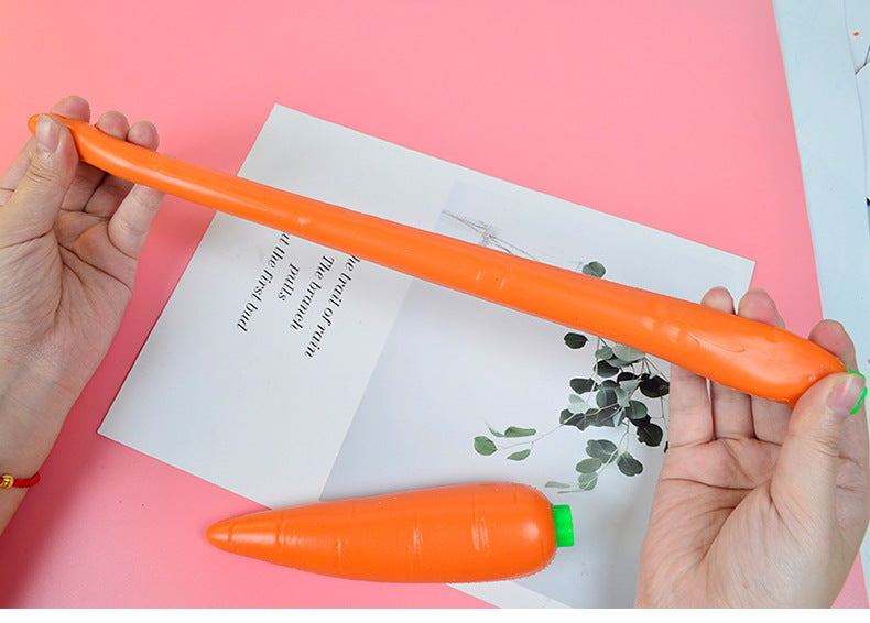 Orange carrot-shaped stress relief toy with green cap, shown horizontally