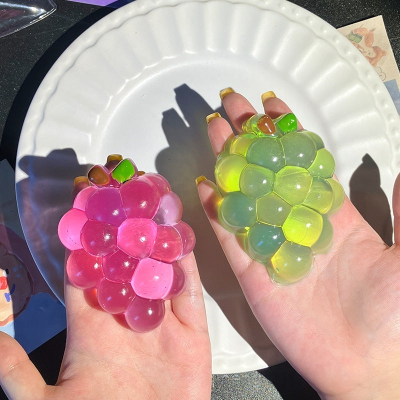 Transparent grape stress-relief toy, purple and green hex-tile fidget shape