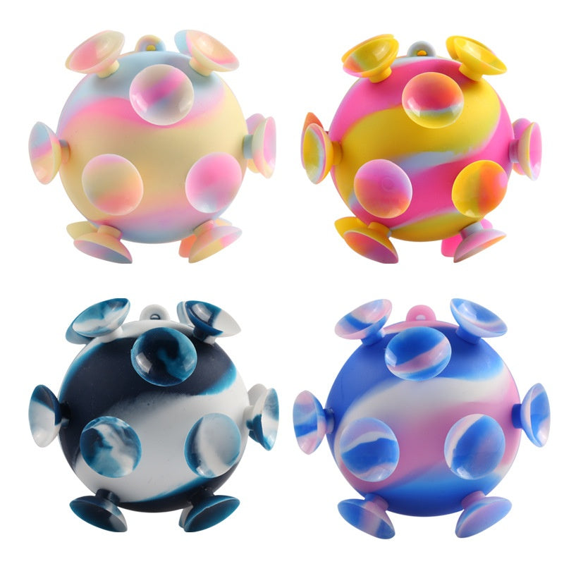Set of four 3D silicone stress balls: pastel, yellow-pink, blue, and dark blue