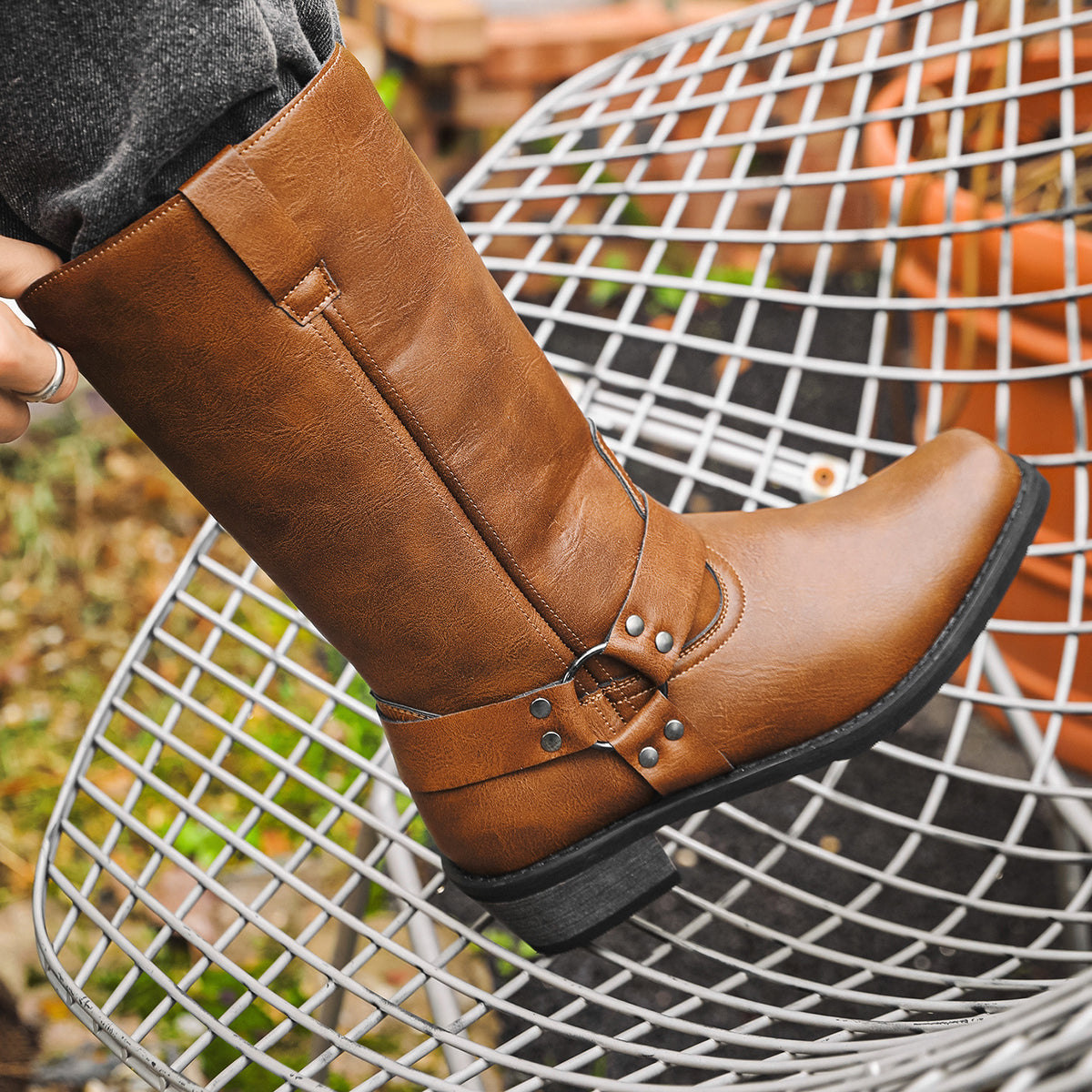 Tan/brown cowboy boots with square toe, chunky heel, slip-on shaft and buckle detail.