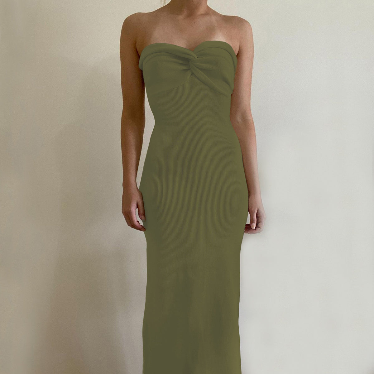 Olive green off-shoulder knit long dress with knotted bust and fitted column silhouette.