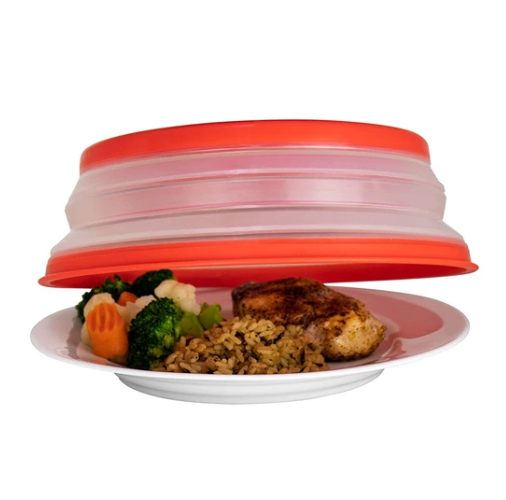 Collapsible microwave splash cover with vented red lid and clear base, over plate food