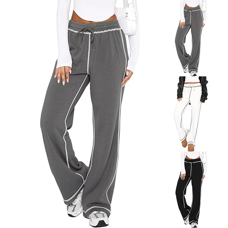 Gray jogger sweatpants with drawstring, elastic waist, and white side stripe