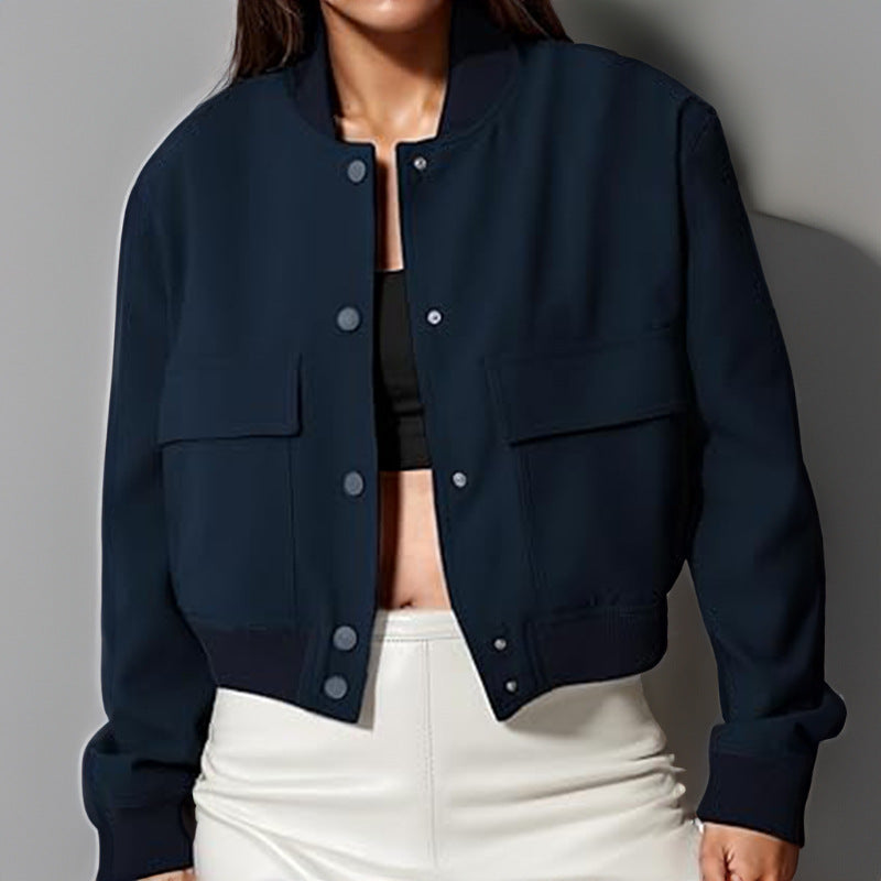 Navy button-up stand-collar jacket with chest pockets and ribbed snap cuffs, long sleeves